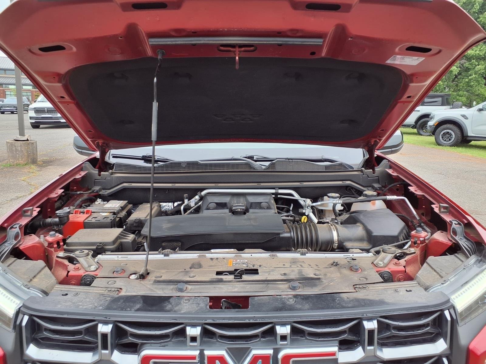 Used 2025 Volcanic Red Tintcoat GMC 4WD AT4 image 31
