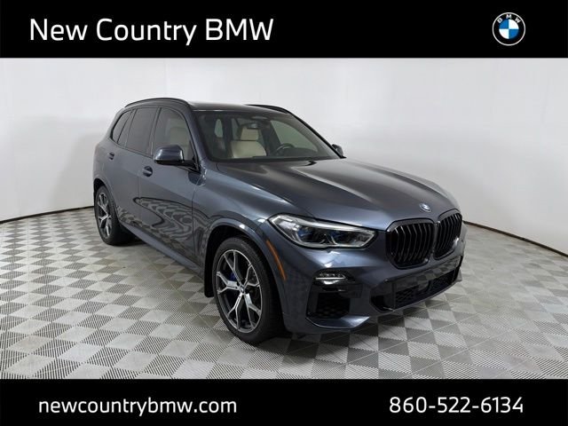 Used 2021 Arctic Grey Metallic BMW xDrive40i image 1