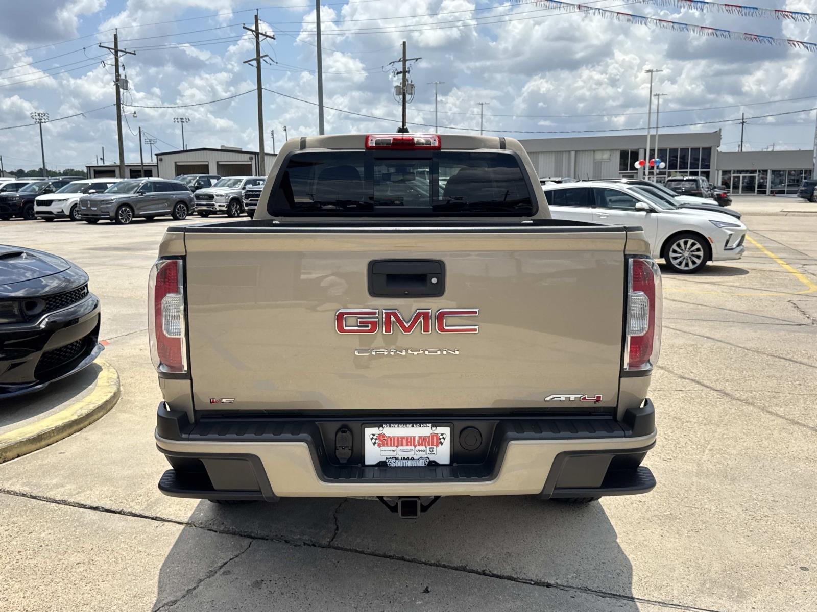 Used 2022 Desert Sand Metallic GMC 4WD AT4 w/Cloth image 6