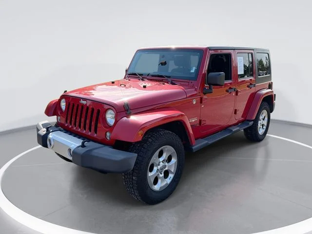 Used 2014 Red Jeep Unlimited Sahara image 1
