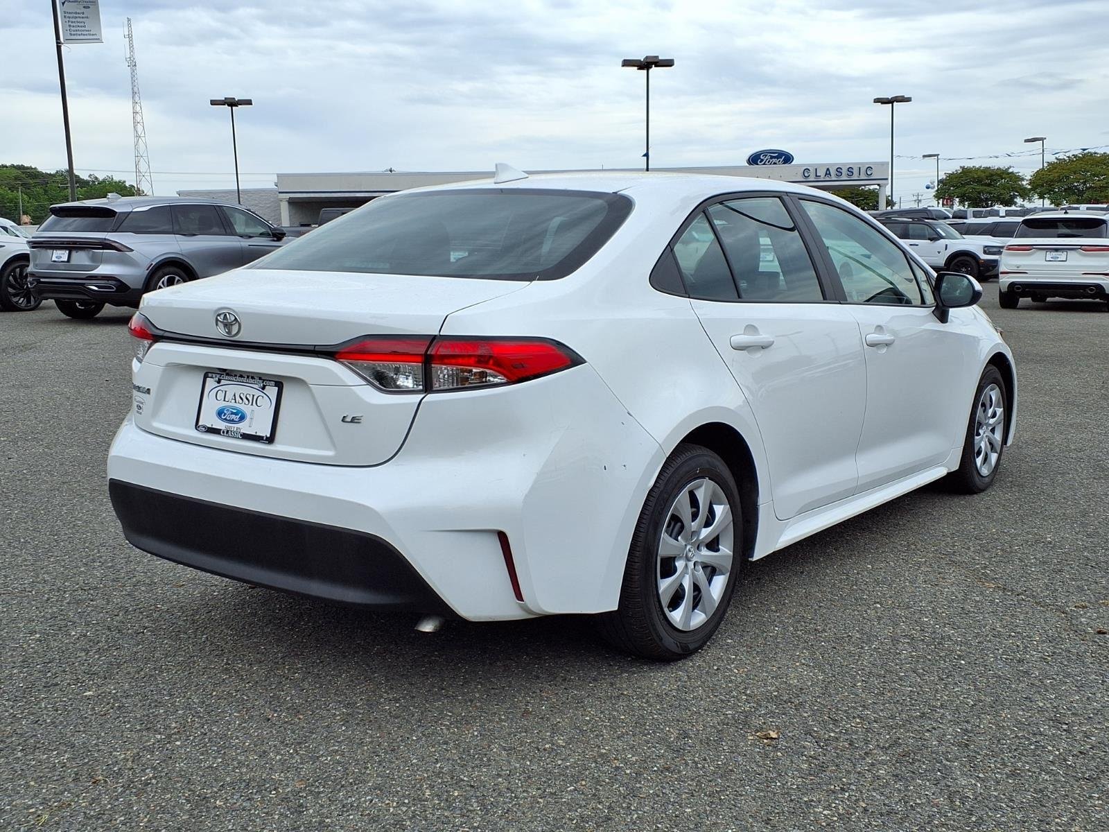 Used 2024 Midnight Black Metallic Toyota LE image 2