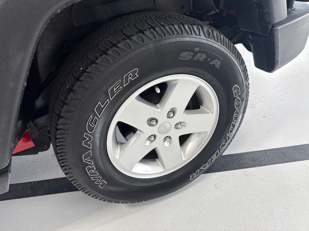Used 2011 Red Jeep Unlimited Sport image 10