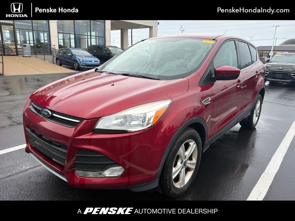 Used 2014 Ruby Red Ford SE image 1