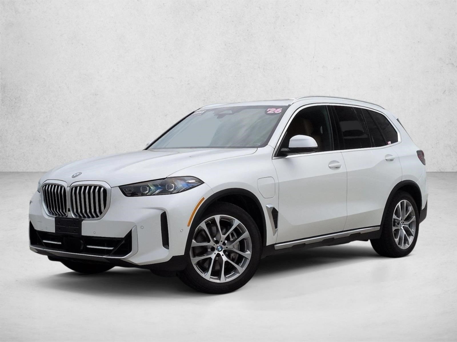 Used 2026 Mineral White Metallic BMW xDrive50e image 1