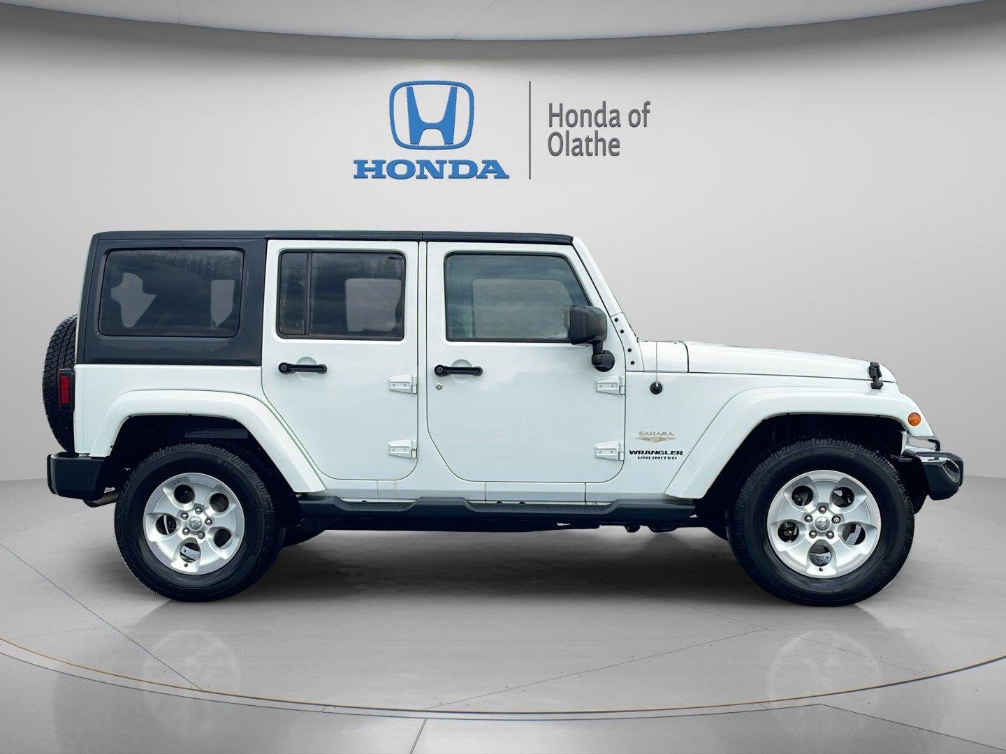 Used 2014 Jeep Wrangler Unlimited Sahara with VIN 1C4BJWEG7EL229733 for sale in Kansas City