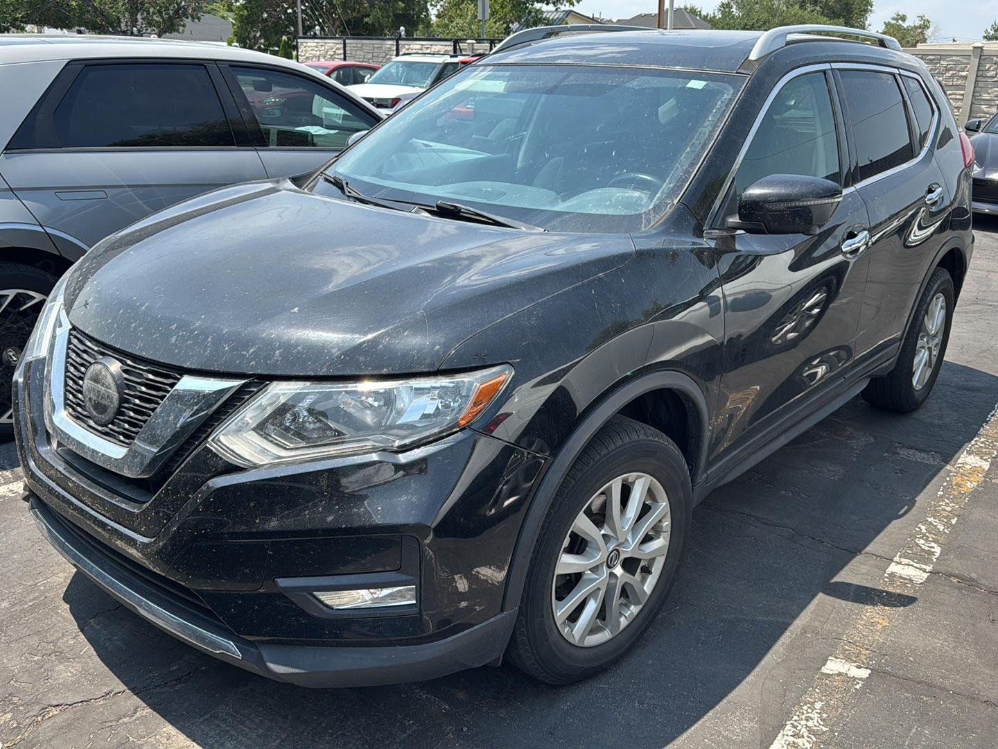Used 2018 Magnetic Black Nissan SV image 1