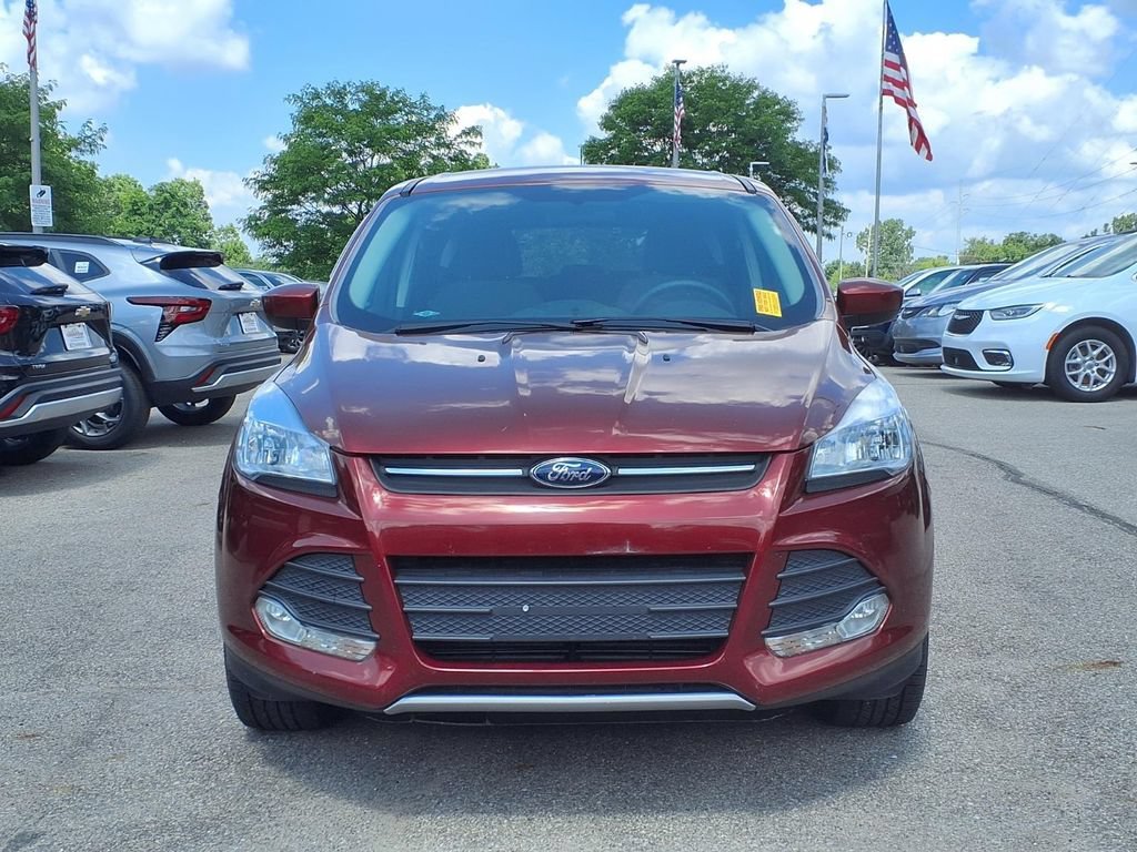 Used 2014 Orange Ford SE image 2