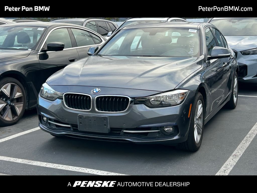 Used 2017 Mineral Gray Metallic BMW 330i image 1
