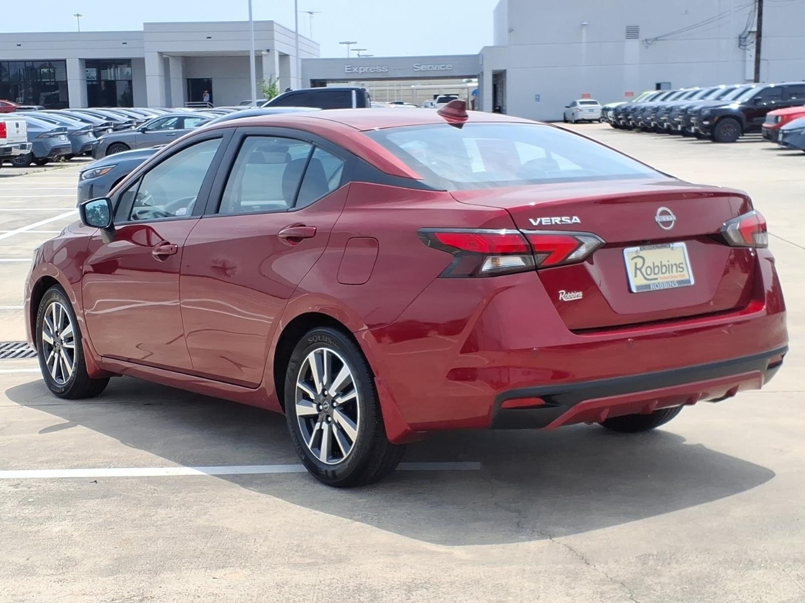 2025 Nissan Versa SV Red at Robbins Nissan