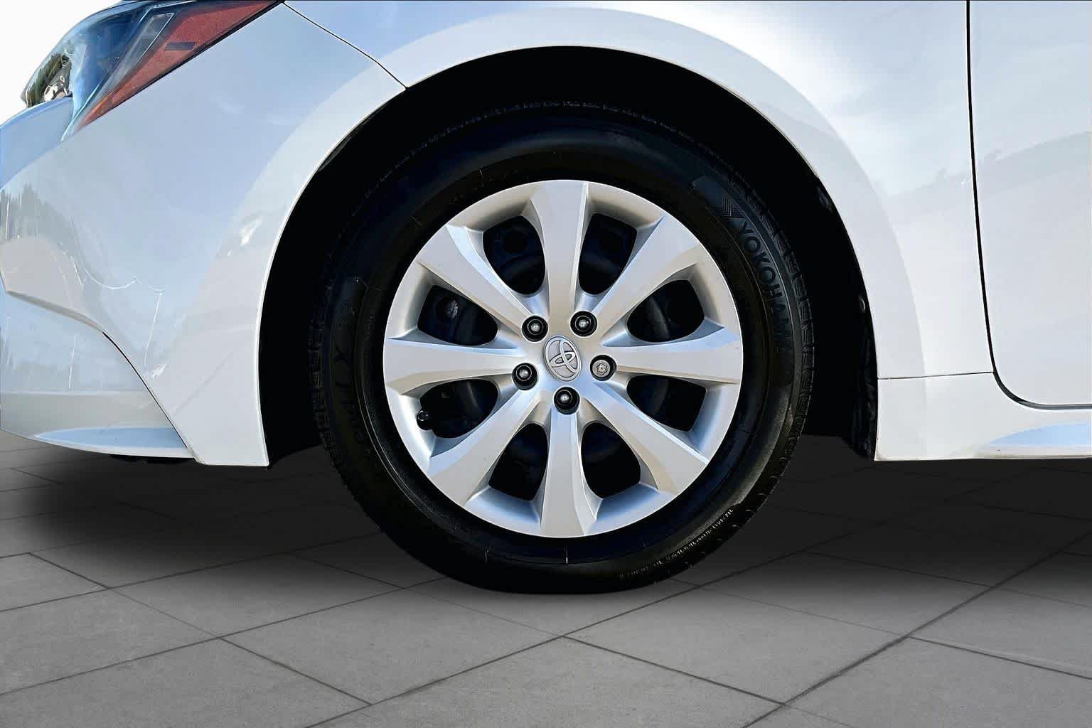 Used 2021 Super White Toyota LE image 11