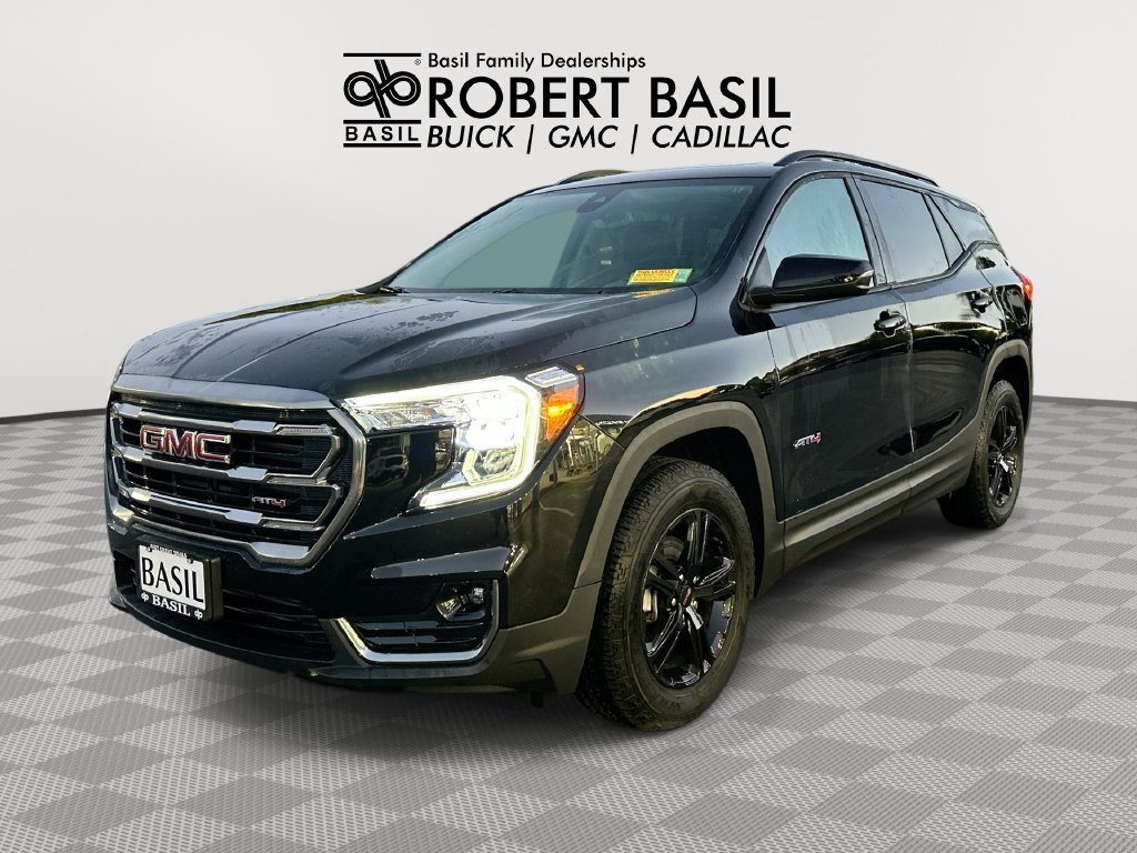 Used 2024 Ebony Twilight Metallic GMC AT4 image 1