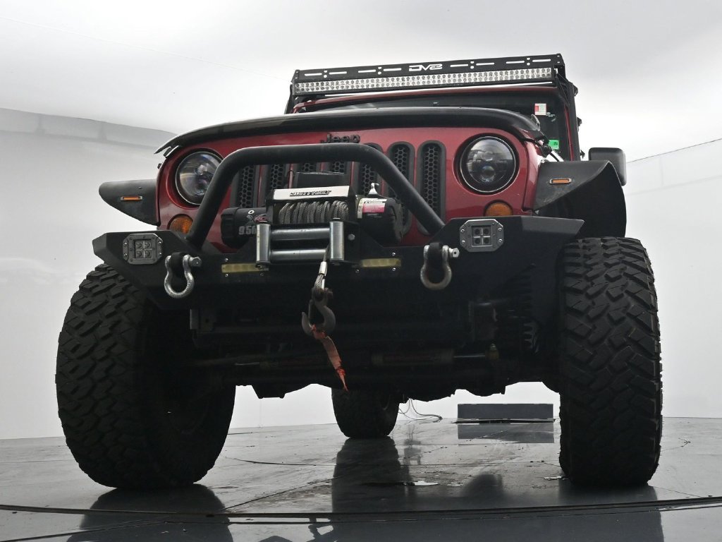 Used 2012 Red Jeep Unlimited Sport image 19