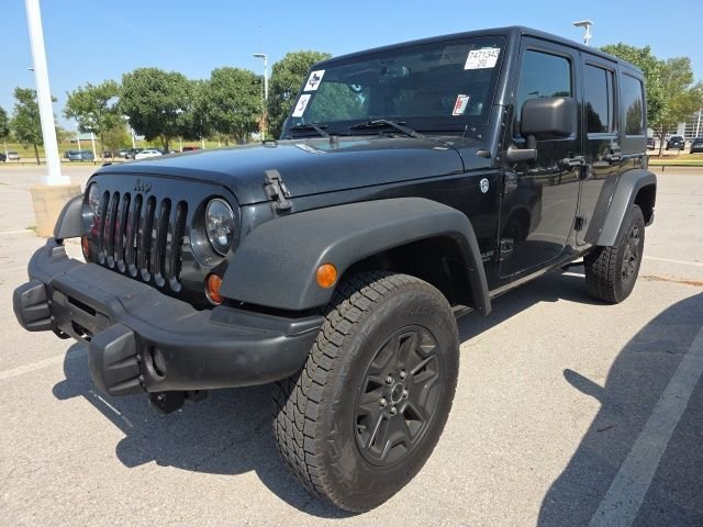 Used 2013 Black Jeep Unlimited Sahara image 3