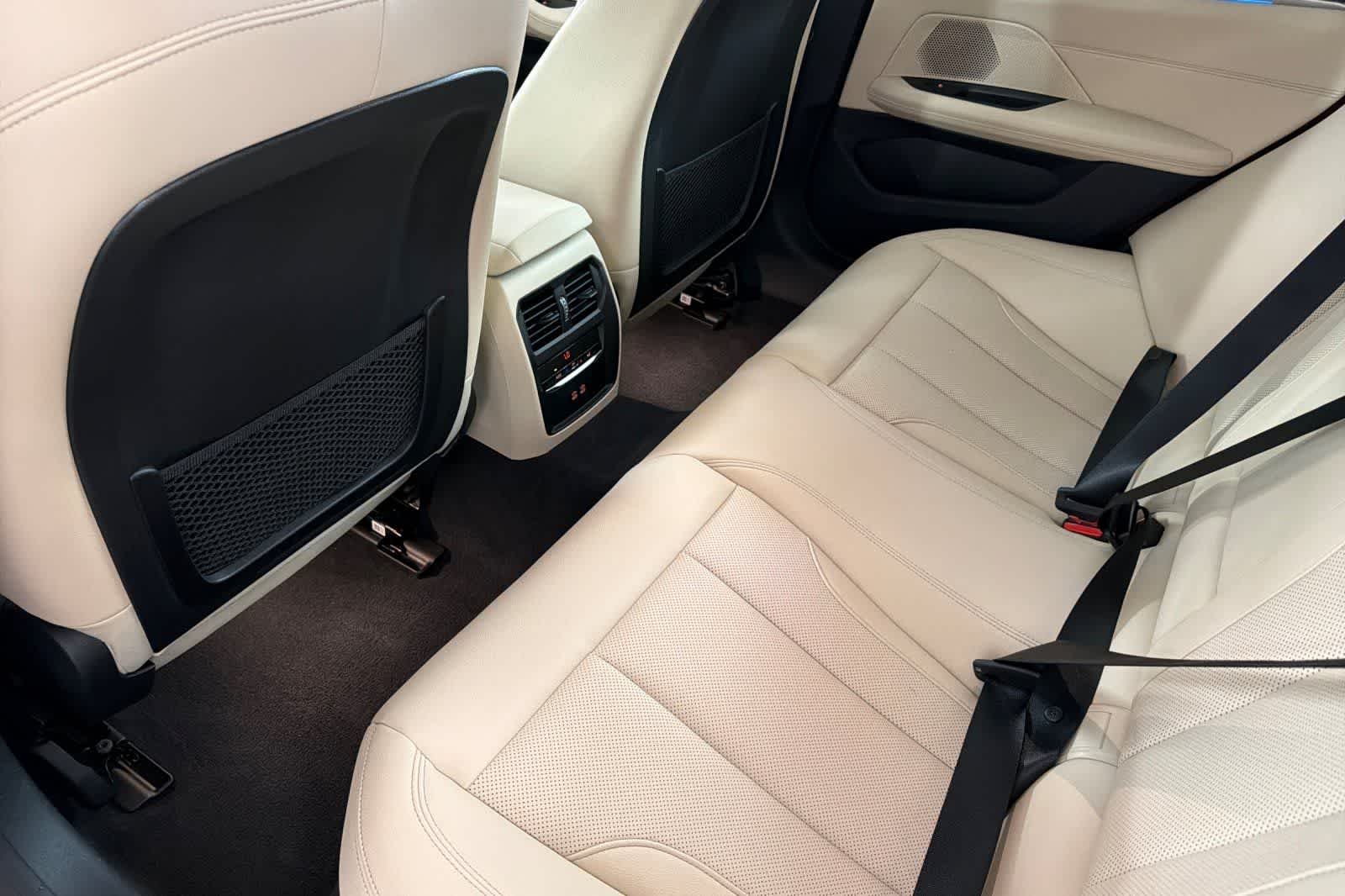 Used 2024 Sunset Orange Metallic BMW eDrive40 image 4