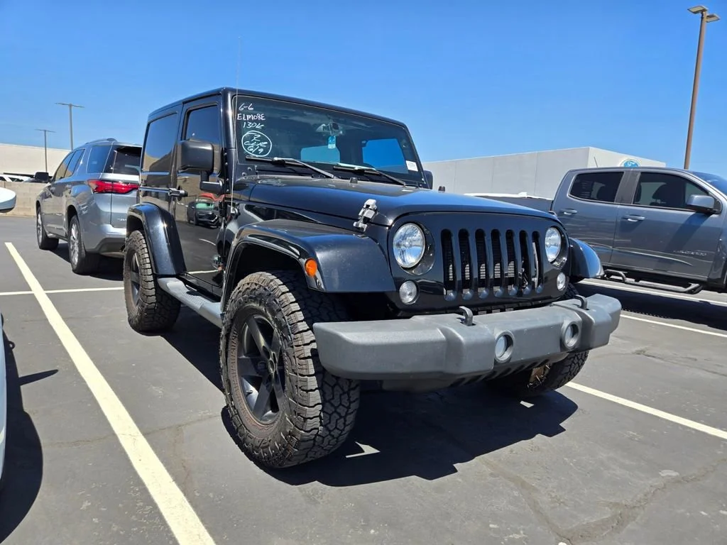 Used 2015 Black Clearcoat Jeep Sahara image 1