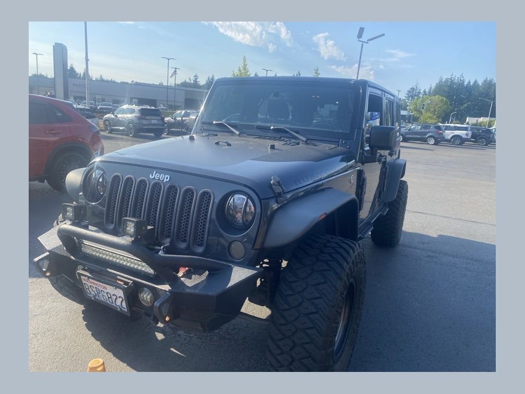 Used 2016 Black Jeep Unlimited Rubicon image 1