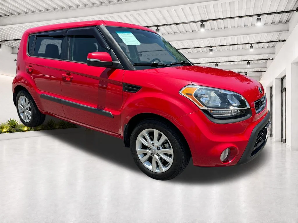 Used 2013 Red Kia Plus image 1