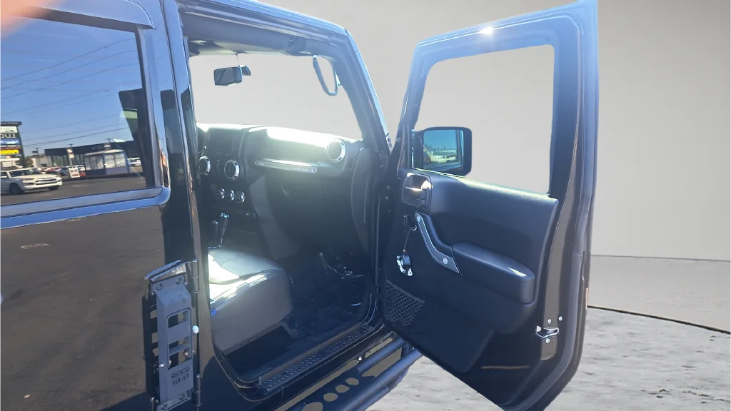 Used 2015 Black Jeep Unlimited Sahara image 14