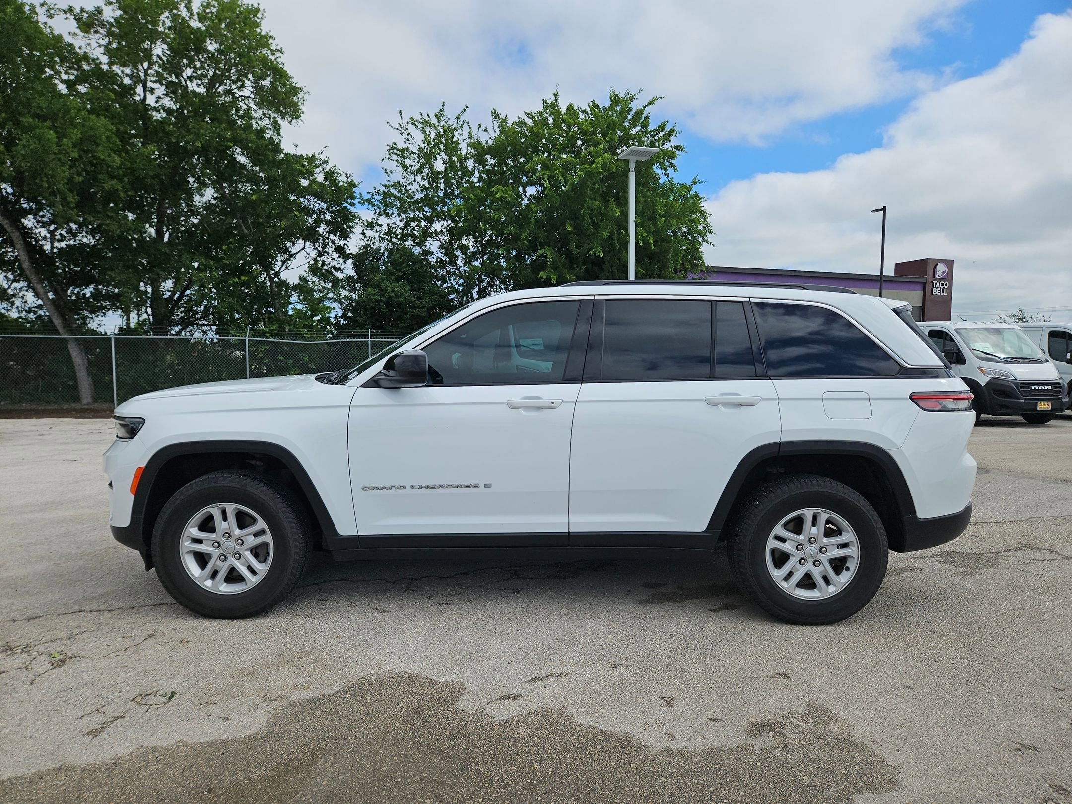 Used 2024 Bright White Clearcoat Jeep Laredo A image 6