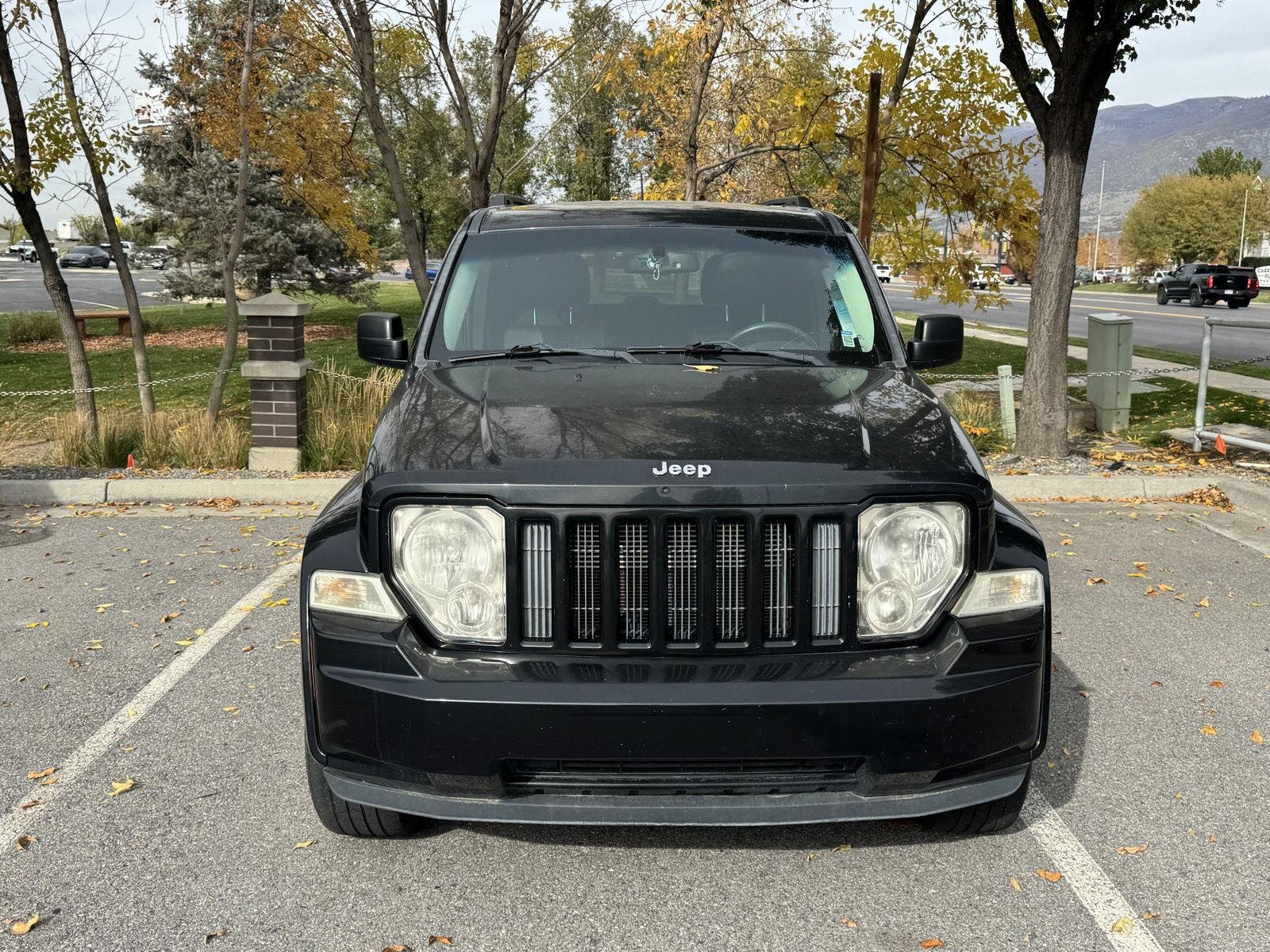 Used 2012 Brilliant Black Crystal Pearl Jeep Sport Latitude image 3