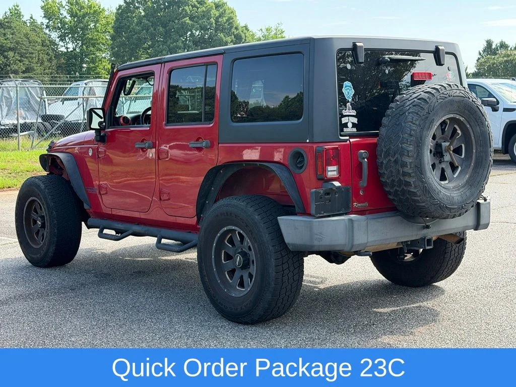 Used 2014 Red Jeep Unlimited Sport image 7