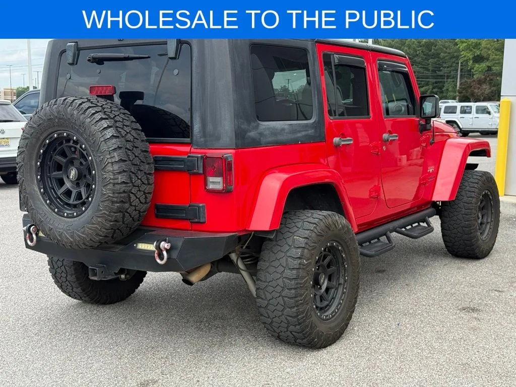 Used 2016 Red Jeep Unlimited Sahara image 23