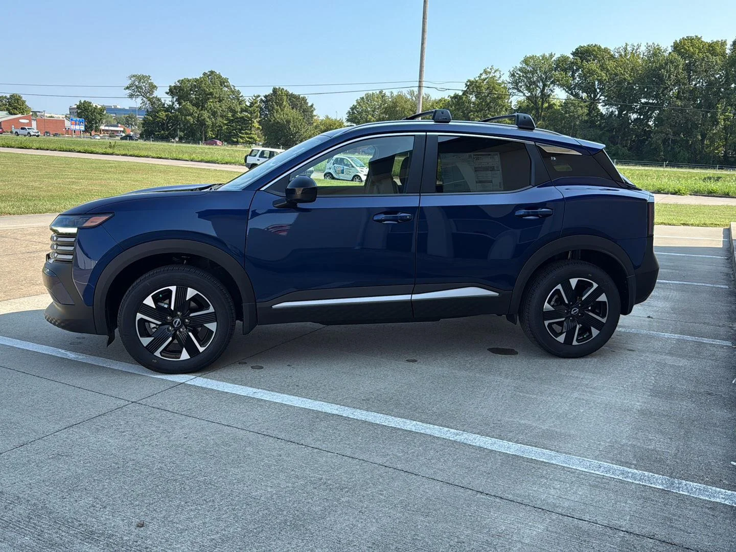 New 2027 Deep Blue Pearl Nissan SV image 4