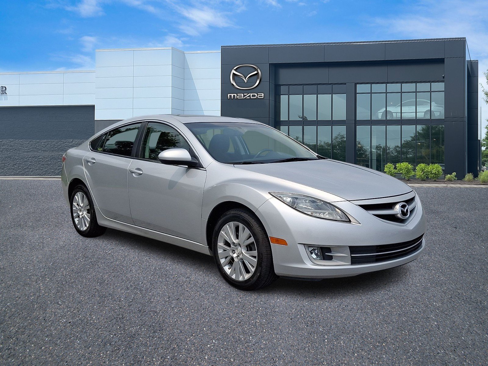 Used 2010 Brilliant Silver Metallic Mazda i Touring Plus image 1