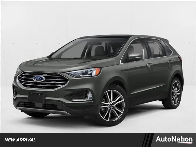Used 2019 Magnetic Metallic Ford Titanium image 1