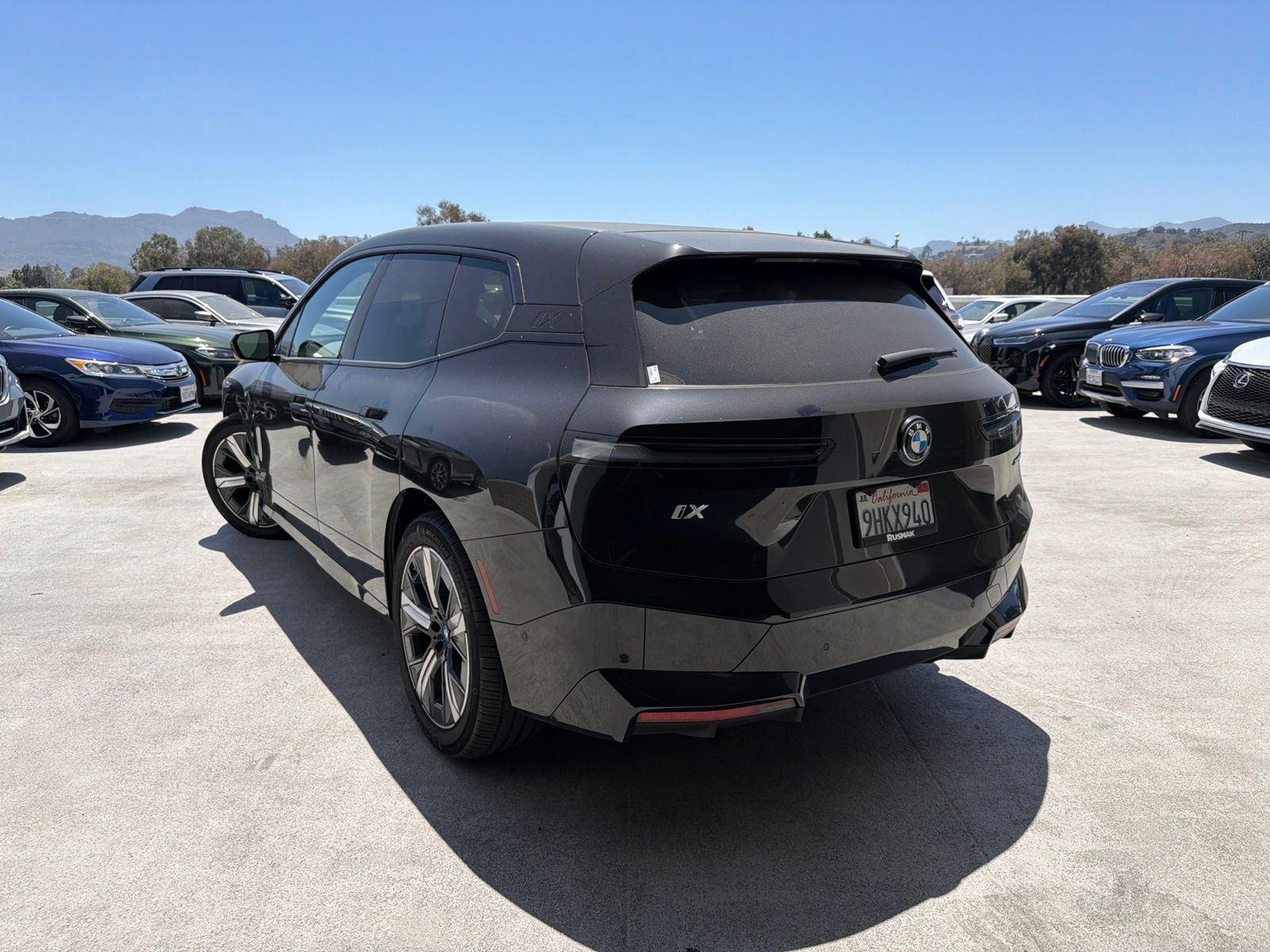 Used 2024 Black Sapphire Metallic BMW xDrive50 image 2