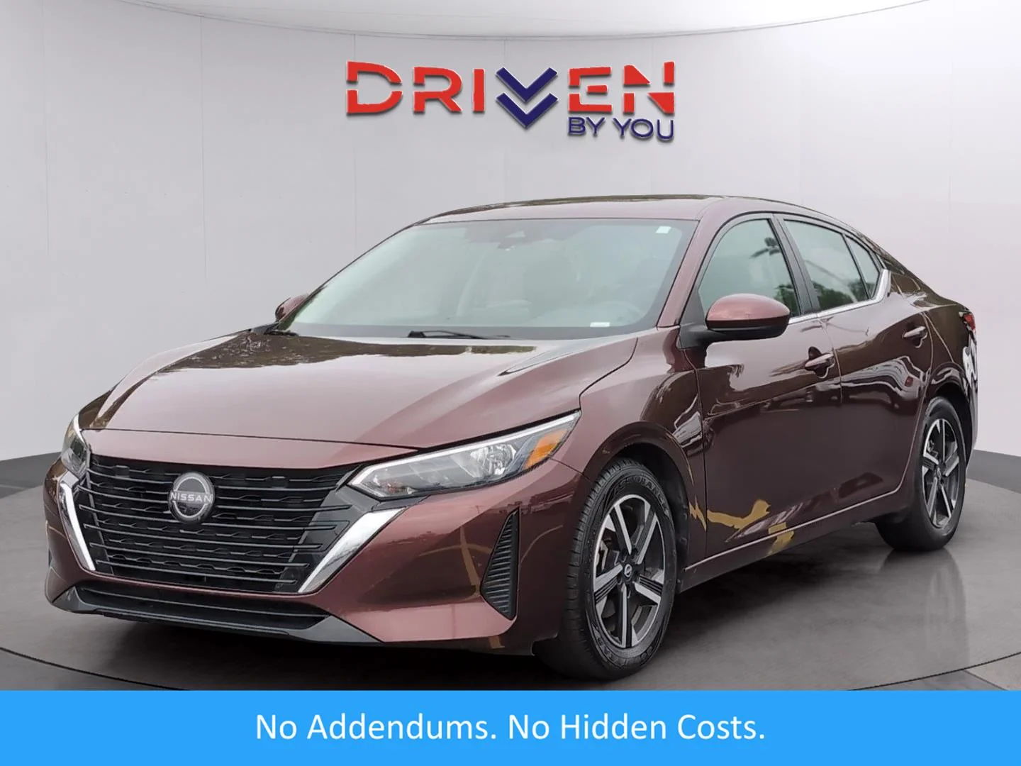Used 2024 Rosewood Metallic Nissan SV image 1