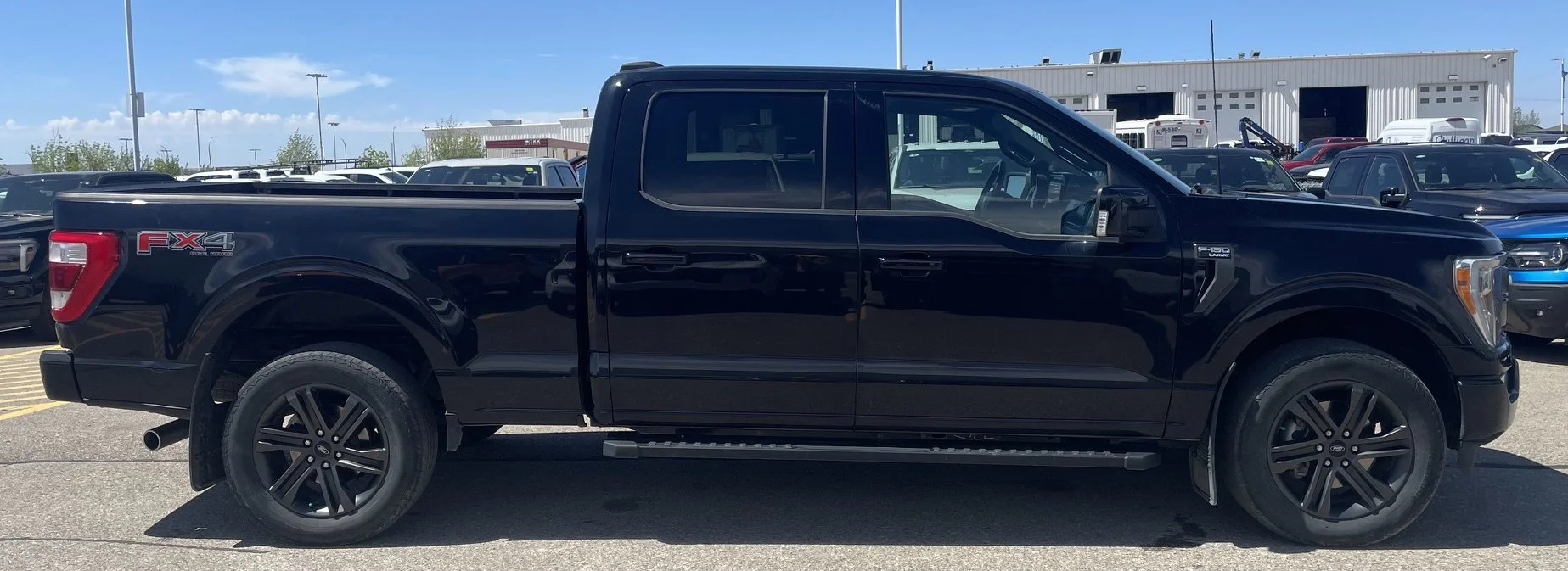 Used 2022 Black Ford LARIAT SuperCrew image 6
