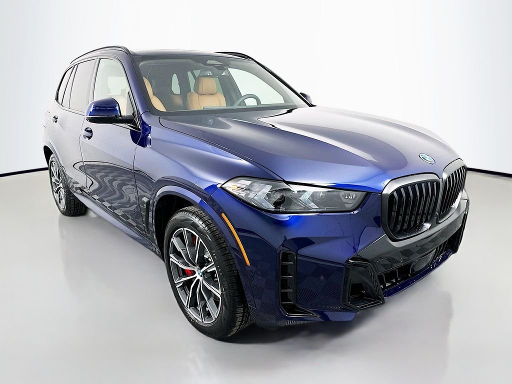 Used 2026 Tanzanite Blue II Metallic BMW xDrive50e image 3