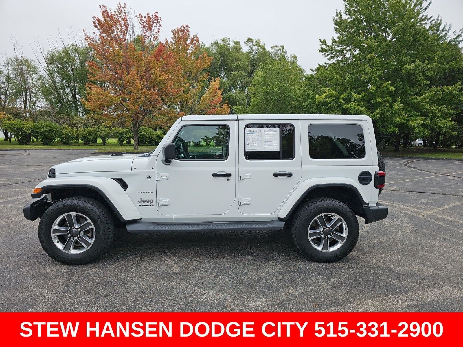 Used 2019 Bright White Clearcoat Jeep Sahara image 1