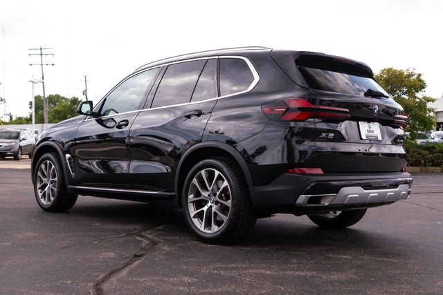Certified Used 2025 Black Sapphire Metallic BMW xDrive40i image 3