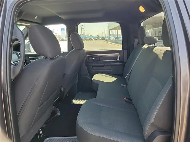 Used 2024 Granite Crystal Metallic Clearcoat RAM SLT 4x2 Crew Cab 5.6 ft. box 140 in. WB image 8