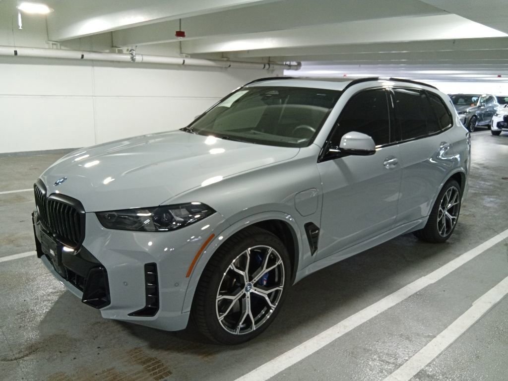 Used 2024 Brooklyn Grey Metallic BMW xDrive50e image 1