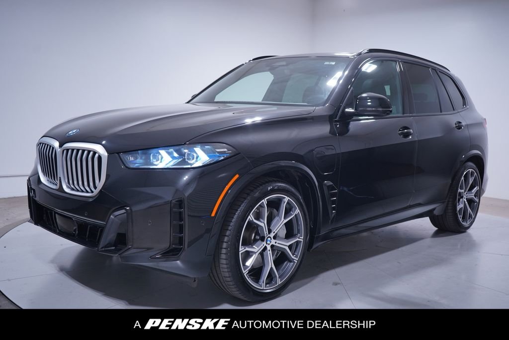 Used 2026 Black Sapphire Metallic BMW xDrive50e image 1