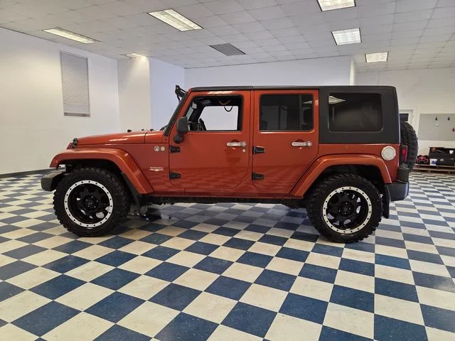 Used 2009 Orange Jeep Unlimited Sahara image 4