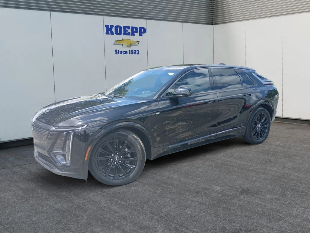 Used 2024 Stellar Black Metallic Cadillac Sport 1 image 1