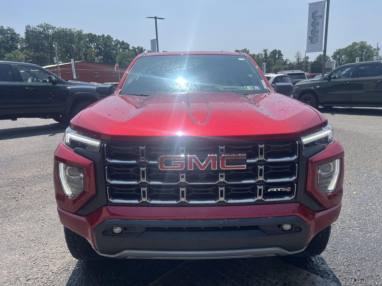 Used 2024 Volcanic Red Tintcoat GMC 4WD AT4 image 8