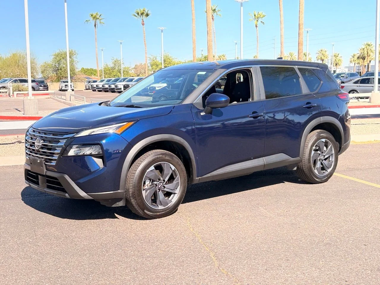 Used 2025 Deep Ocean Blue Pearl Nissan SV image 1