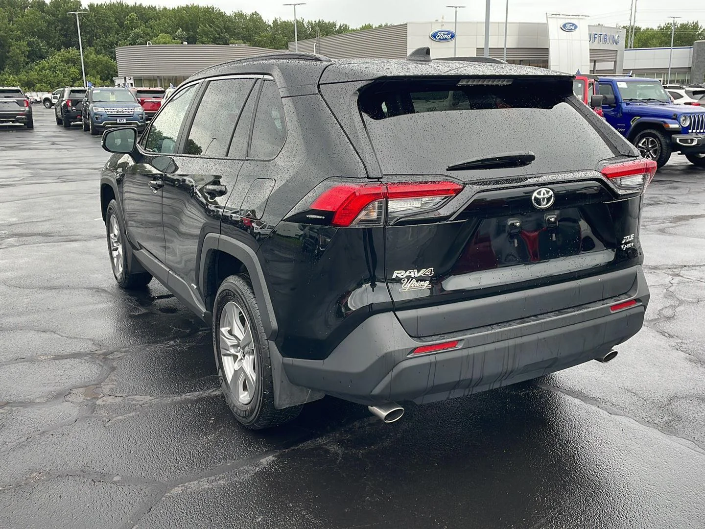 Used 2025 MIDNIGHT BLACK METALLIC TOYOTA TRUCK HYBRID XLE image 3