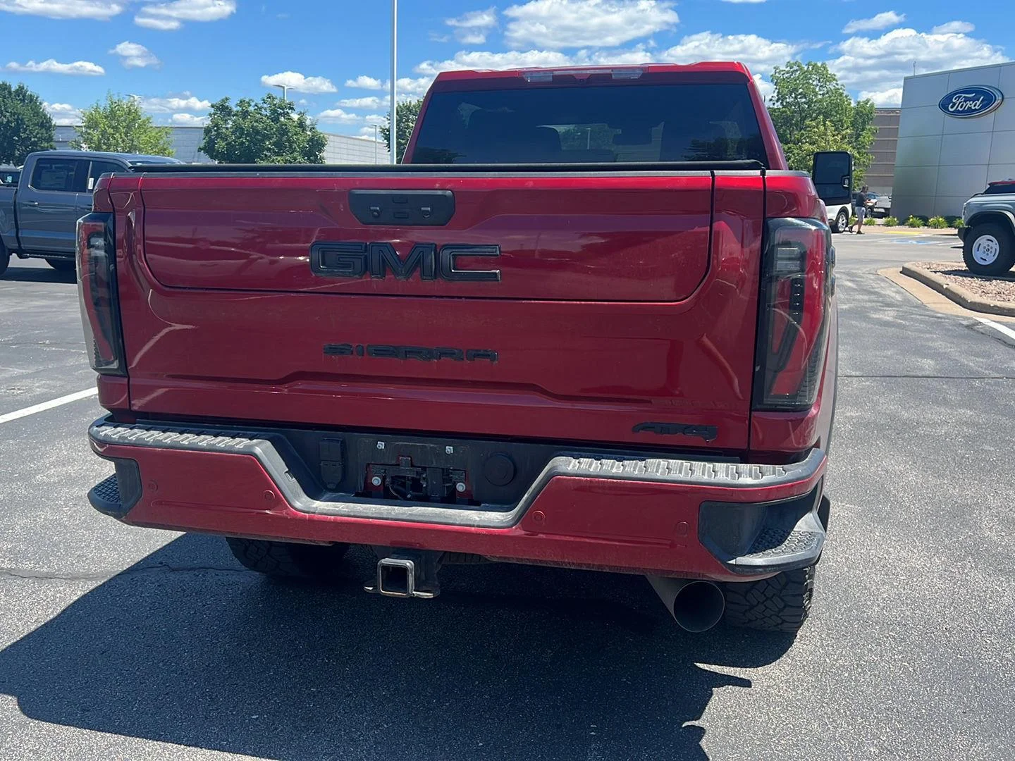 Used 2024 Volcanic Red Tintcoat GMC AT4 image 9