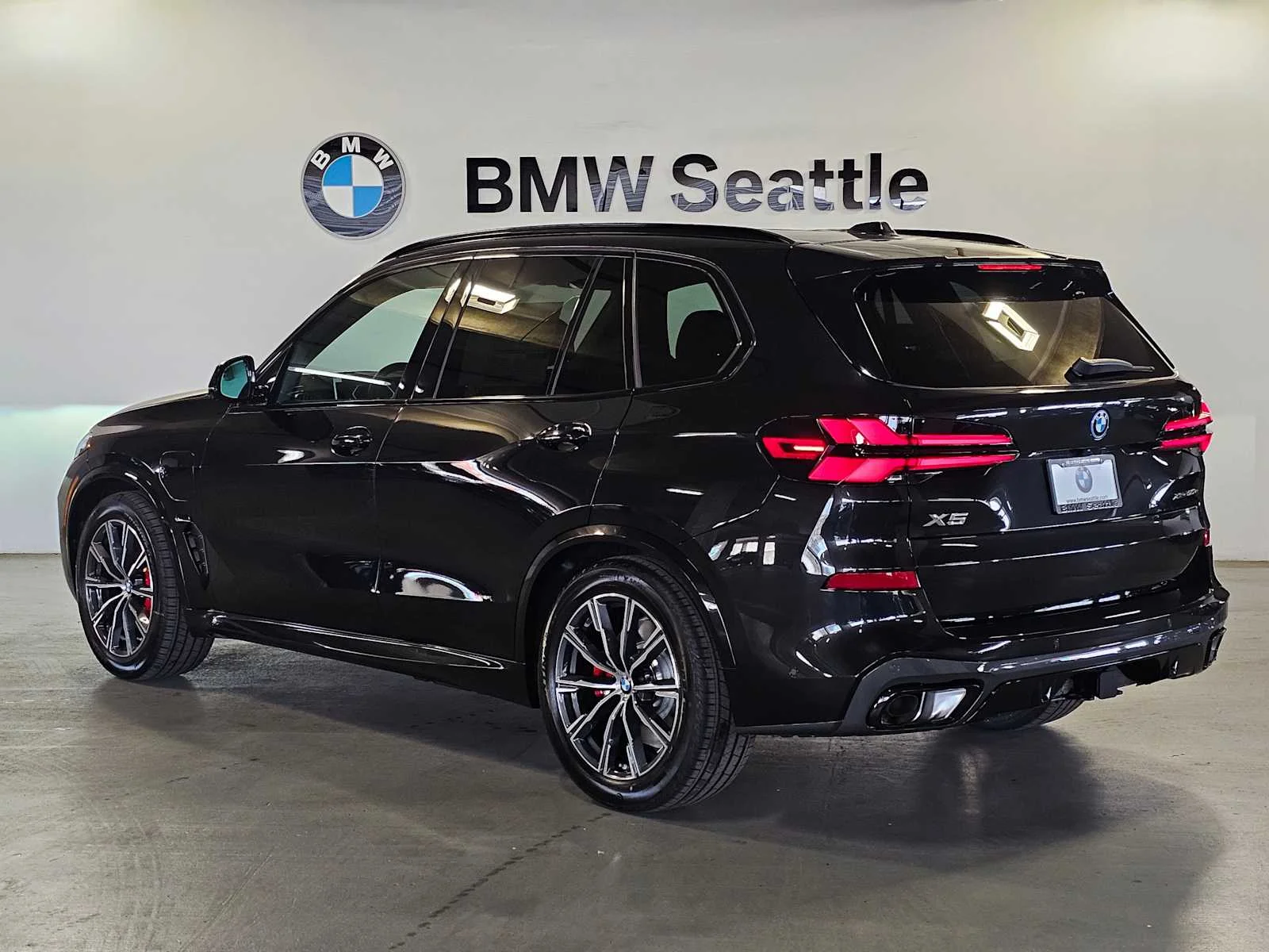 New 2026 Black Sapphire Metallic BMW xDrive50e image 4