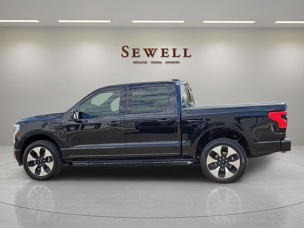 Used 2022 Ford F-150 Lightning Platinum with VIN 1FT6W1EV2NWG06648 for sale in Midland, TX