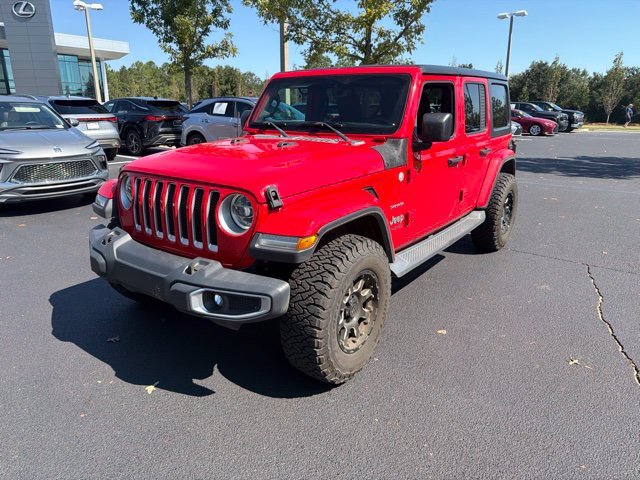 Used 2019 Red Jeep Unlimited Sahara image 1