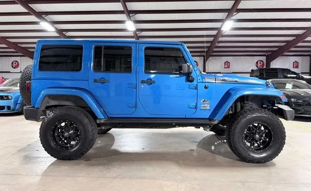 Used 2014 Blue Jeep Unlimited Sahara image 2