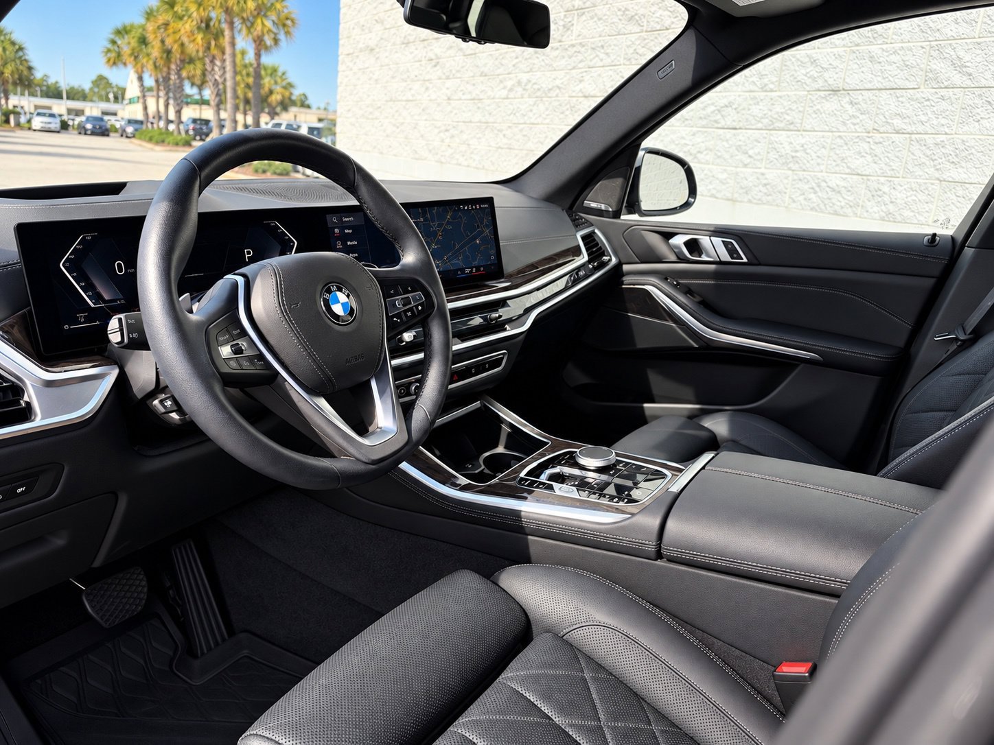 Certified Used 2025 Black Sapphire Metallic BMW xDrive40i image 2