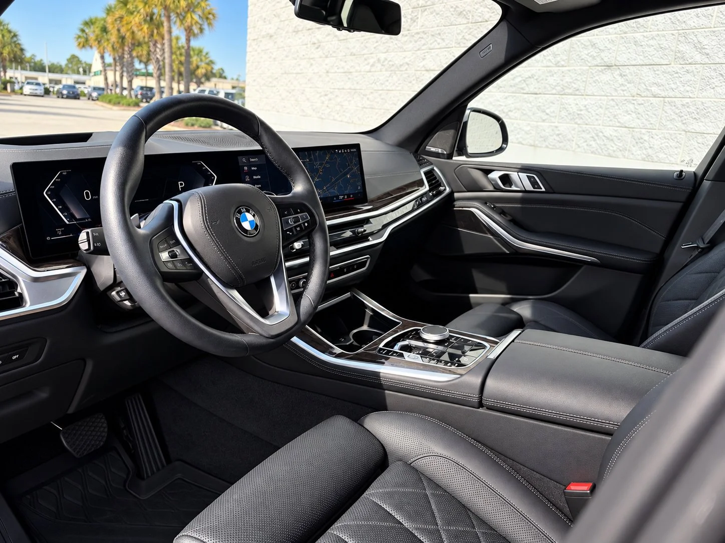 Certified Used 2025 Black Sapphire Metallic BMW xDrive40i image 2